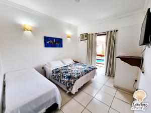 Postel nebo postele na pokoji v ubytování Pousada Conchas de Paraty