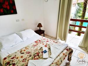 Postel nebo postele na pokoji v ubytování Pousada Conchas de Paraty