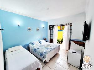 Postel nebo postele na pokoji v ubytování Pousada Conchas de Paraty