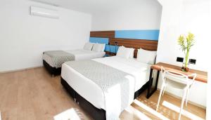 Katil atau katil-katil dalam bilik di Foresta Hotel