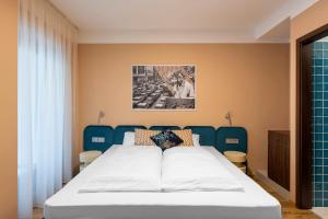 Postel nebo postele na pokoji v ubytování SWU Magazine Rooms