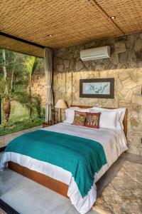 Cama ou camas em um quarto em Embaúba Boutique Hotel