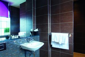 a bathroom with a sink and a mirror at EPIC Seel Street Apartments - Liverpool City Centre in Liverpool +19 photos
