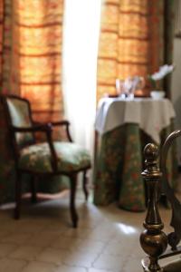 A bed or beds in a room at La Quercia Antica B&B