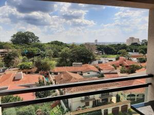 a view of a city from the balcony of a building at Ribeirania-Zeus 67-Garagem-WIFI-Pet Friendly in Ribeirão Preto