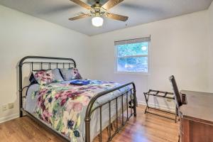 a bedroom with a bed and a ceiling fan at Lakefront Macon Getaway Grill, Pet Friendly! in Macon