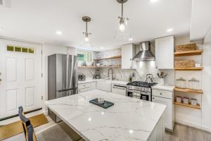 a kitchen with white cabinets and a white counter top at The Studio in Seattle