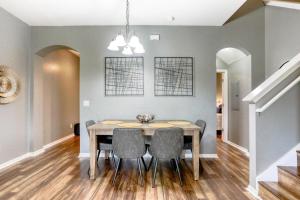 a dining room with a table and chairs at Calabria Home - Regal Palms Resort in Davenport