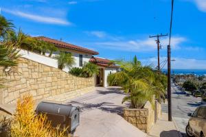 a house on a street with a palm tree at Buena Vista #2 in Ventura