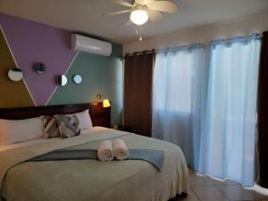Postel nebo postele na pokoji v ubytování Hotel Sea Breeze Sosua
