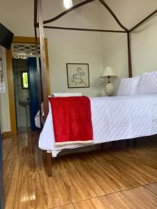 Postel nebo postele na pokoji v ubytování Suítes Casa da Colônia