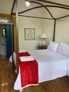 Postel nebo postele na pokoji v ubytování Suítes Casa da Colônia
