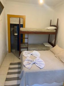 Postel nebo postele na pokoji v ubytování Suítes Casa da Colônia