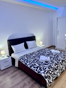 Ένα ή περισσότερα κρεβάτια σε δωμάτιο στο Hugo Bianca LUX