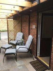 a pair of chairs sitting on a patio at St Marks Court Holiday Homes - No1 in Marske-by-the-Sea