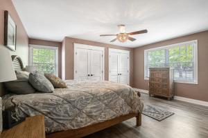 a bedroom with a bed and a ceiling fan at Town of Ocean View --- 30680 Cedar Neck Rd in Ocean View +36 photos
