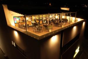 a view of a restaurant at night with lights at Hotel Boutique Aquarel in Zalău