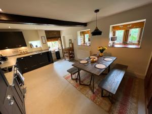 an overhead view of a living room with a table at Braunston Manor Cottage in Braunston +28 photos