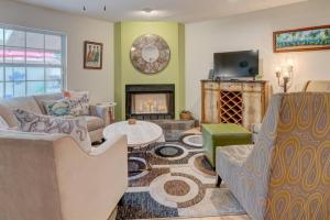 a living room with a couch and a fireplace at Getaway to iki Tampa is an End Unit Townhome - Close to Tampa Bay & Downtown - Minutes to Airport in Tampa