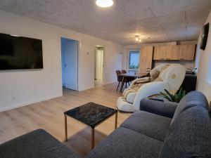 a living room with a couch and a table at Bonico in Horsens