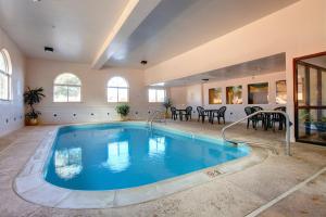 a large indoor swimming pool in a house at Americas Best Value Inn and Suites Saint Charles in St. Charles