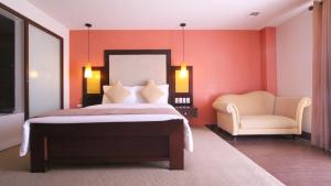 Ένα ή περισσότερα κρεβάτια σε δωμάτιο στο Coron Gateway Hotel & Suites