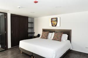 Postel nebo postele na pokoji v ubytování Hotel Qatar Cali + 37 fotografií