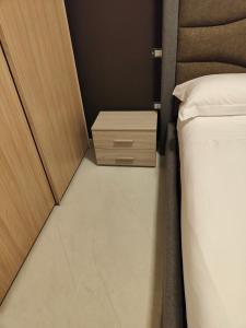 A bed or beds in a room at Fantasia B&B APARTAMENT STUDIO