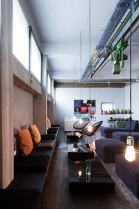 a large living room with couches and a couch at WALLYARD CONCEPT HOSTEL Berlin in Berlin
