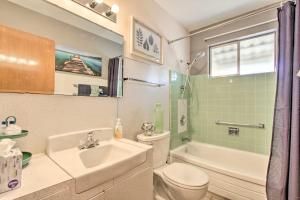 a bathroom with a sink and a toilet and a shower at Golf Course and Pool Access Quaint Sun City Home in Sun City +20 photos