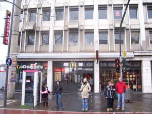 a group of people standing in front of a building at Black Sheep in Cologne