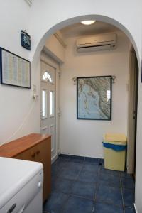 a hallway with an archway in a room at Apartments by the sea Dramalj, Crikvenica - 5596 in Dramalj
