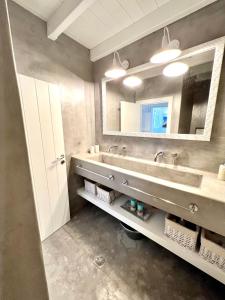a bathroom with a sink and a mirror at Aetheria traditional house in Koskinou +79 photos