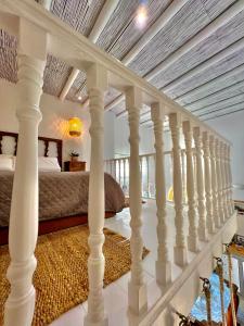 a bedroom with a staircase leading to a bed at Aetheria traditional house in Koskinou