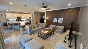 a living room with a couch and a table at New Lovely Home at Sonoma Resort at Tapestry in Kissimmee