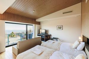 Letto o letti in una camera di the salon 伊豆高原 Hotels & Resort