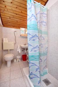 a bathroom with a toilet and a sink at Apartments by the sea Hvar - 591 in Hvar