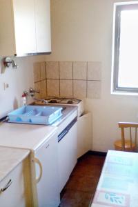 a kitchen with a sink and a counter top at Apartments by the sea Hvar - 591 in Hvar