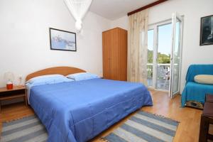Ένα ή περισσότερα κρεβάτια σε δωμάτιο στο Seaside secluded apartments Cove Torac, Hvar - 581