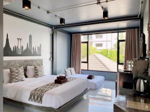 Katil atau katil-katil dalam bilik di Midtown Sukhothai