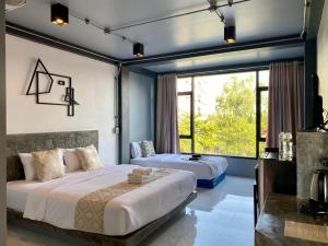 Postel nebo postele na pokoji v ubytování Midtown Sukhothai + 37 fotografií