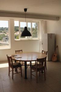 a dining room table and chairs in a kitchen at Apartments by the sea Lumbarda, Korcula - 576 in Lumbarda +11 photos
