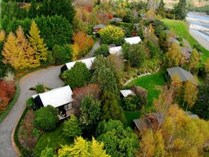 an aerial view of a farm with trees and buildings at Tongariro Lodge in Turangi