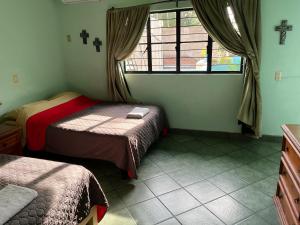 Ліжко або ліжка в номері Casa de los Sueños