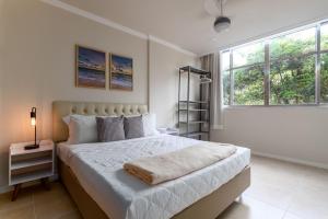 Ένα ή περισσότερα κρεβάτια σε δωμάτιο στο Refúgio em Copacabana - Para 4 pessoas - NSC401 Z4