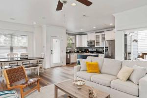 a living room with a white couch and a table at Beautiful 4 bedroom near Rosemary Beach! in Inlet Beach