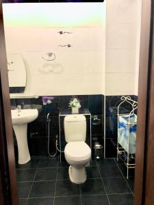 a bathroom with a toilet and a sink at 10 out of 10 VIP Sea view apartment with terrace in Baku