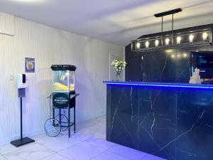 a bar with a blue counter and a fish tank at The Tide's Inn in Parksville