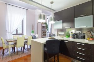 a kitchen and dining room with a table and chairs at Rome Guest House Saint Peter in Rome