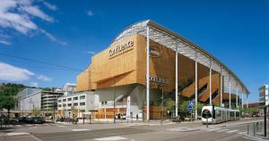 a building with a train in front of it at ibis budget Lyon Centre Confluence in Lyon